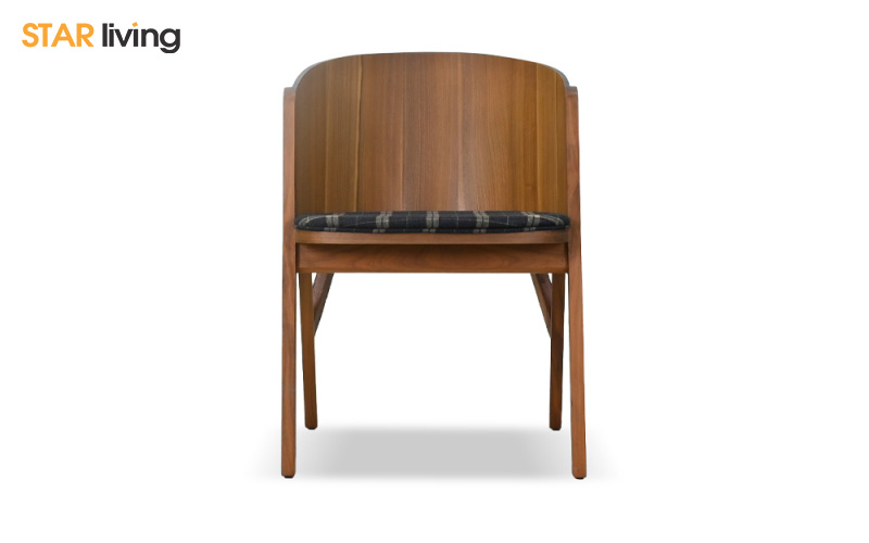 Front view of a wooden chair with a curved backrest and a dark plaid seat cushion.